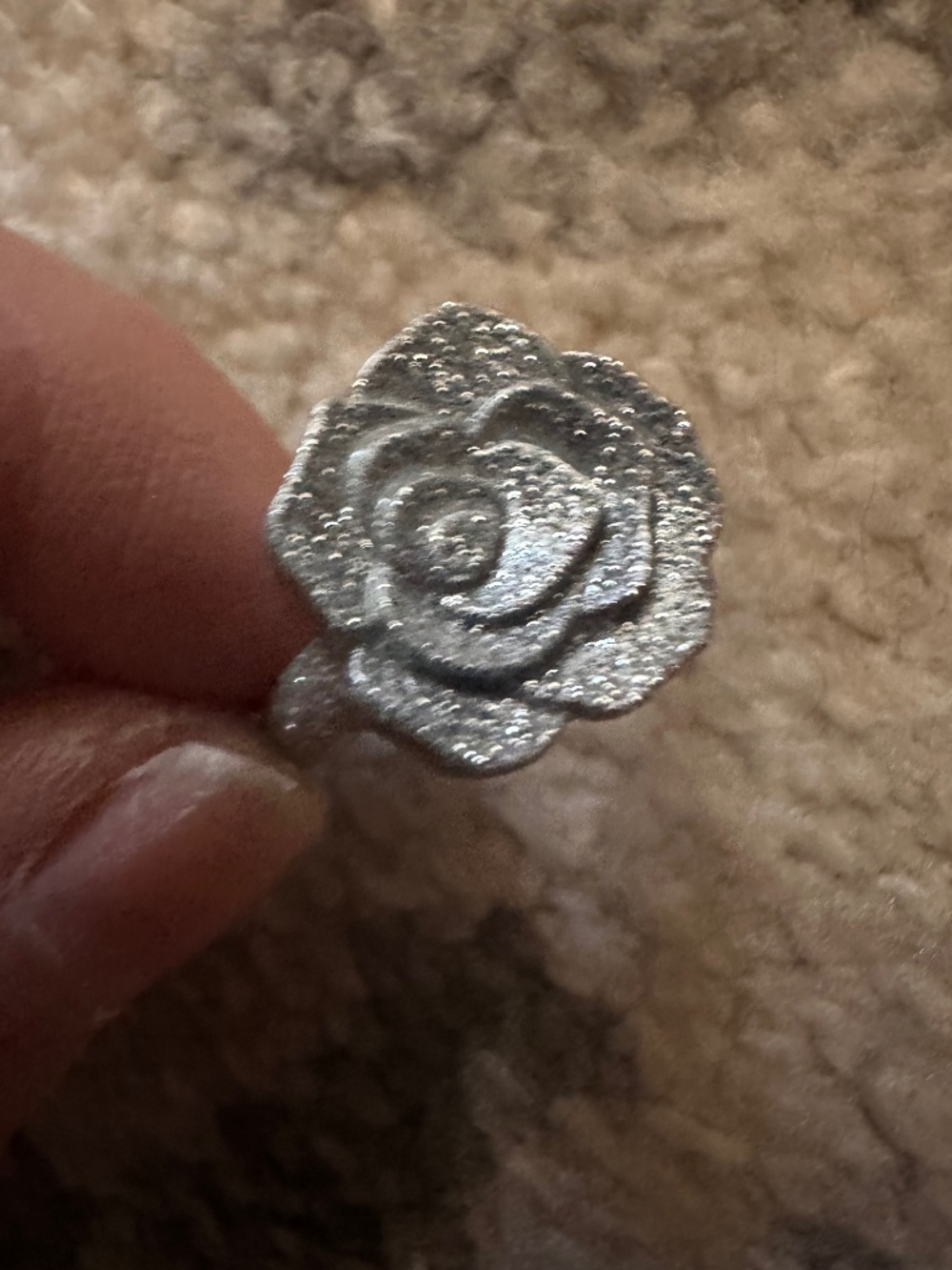 Plastic silver rose ring from hard candy make up